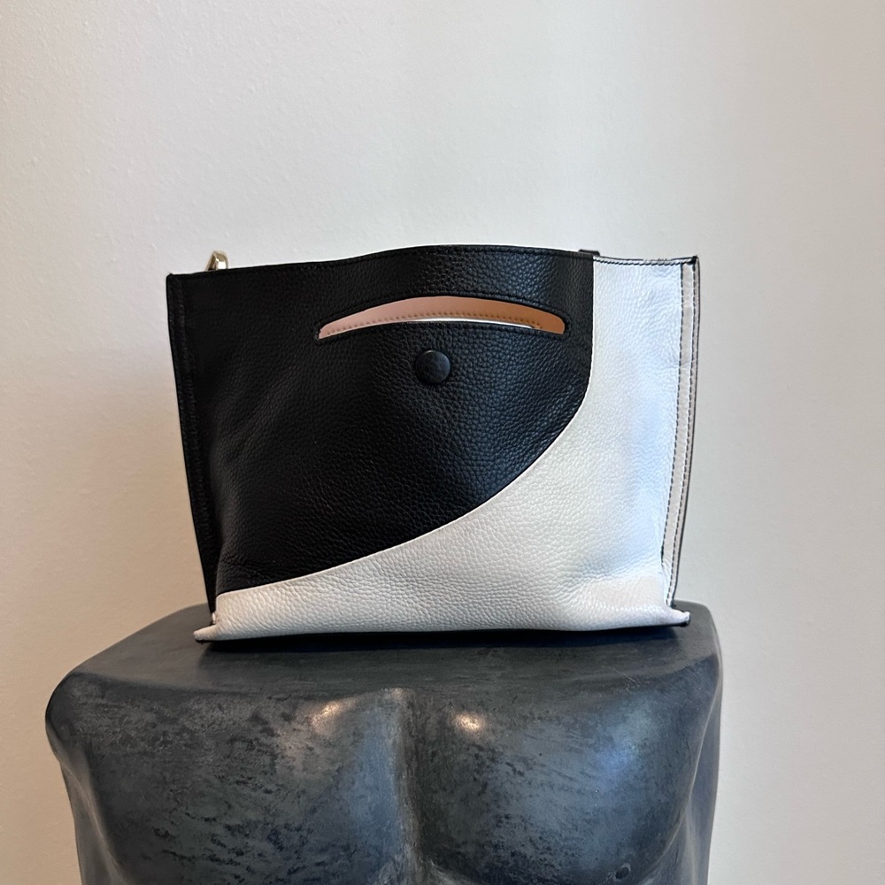Sondra Robert’s black and white crossbody clutch bag